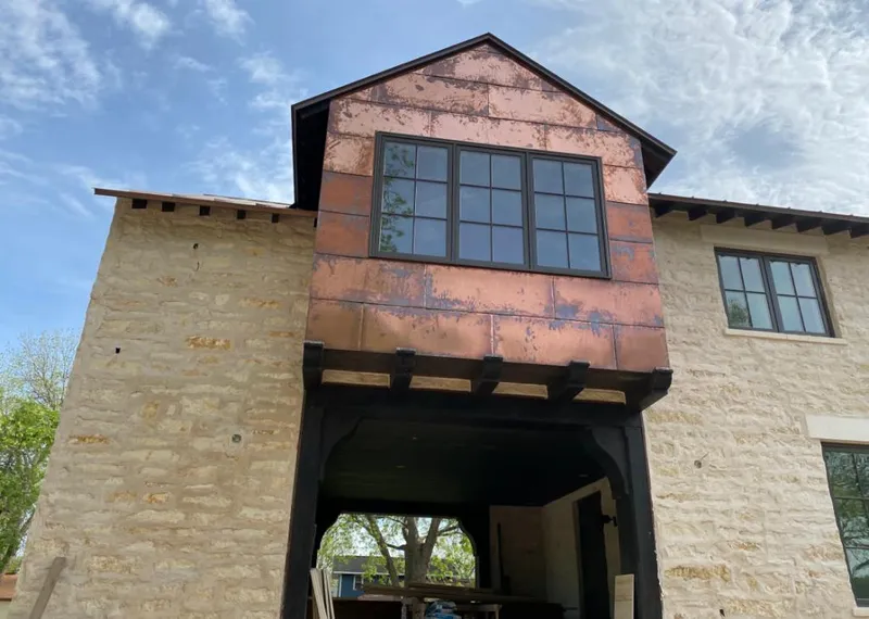 Copper metal panel facade on a stone building for Metal Roof Coating in Beaumont